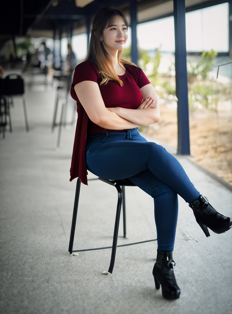 Woman sitting in a chair with her arms crossed